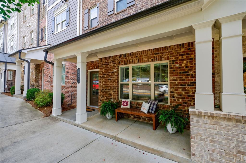 Welcome Home to Downtown Woodstock. Just steps from all the shops, restaurants, boutiques, and charm that make Downtown Woodstock so special, this inviting 3 bed / 3 full bath / 1 half bath townhome offers comfort and convenience in equal measure. Enjoy being minutes from the city’s amphitheater, where fabulous summer concerts and community events fill the season with music and memories. The main floor features 10’ ceilings, fresh paint throughout, and thoughtfully chosen Rejuvenation light fixtures that blend timeless style with modern comfort. An open floor plan connects the spacious kitchen, walk-in pantry, and covered deck — perfect for family gatherings or quiet evenings at home. Upstairs, the generous primary suite offers 9’ ceilings, two large closets, and convenient access to the laundry room. A cozy junior suite ensures family and guests feel right at home. The entry level provides flexibility with a second junior suite — equally suited for guests, hobbies, or a home office — plus a welcoming foyer and an oversized storage closet. Even the two-car garage has been updated with a fresh epoxy floor in colors that complement the home’s design. A comfortable home with thoughtful details, just around the corner from concerts, community, and all the best of Downtown Woodstock.