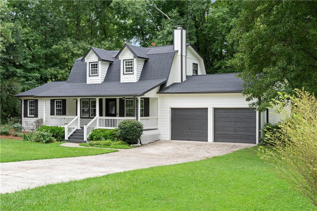 JUST REDUCED111 MOTIVATED SELLER!!! Welcome Home! Discover this charming Ranch-style home tucked away in one of East Cobb’s most established and desirable communities. Situated on a beautiful corner lot, this property has been newly renovated and features a brand-new roof with a 10-year transferable warranty. From the moment you arrive, you’ll be captivated by the spacious front porch, perfect for rocking chairs and enjoying your morning coffee. The exterior was professionally painted in August 2025, giving the home fresh curb appeal. Step inside to a welcoming foyer that opens to a cozy family room and an open-concept floor plan with seamless views into the kitchen and dining area. The fully renovated kitchen boasts luxury quartz countertops, a stylish new backsplash, all-new stainless steel appliances, a modern vent hood, and updated light fixtures throughout.The primary suite on the main level is bright and spacious, offering a fully renovated bathroom with a quartz double vanity, a beautifully tiled shower, and new lighting. Upstairs, you’ll find two additional large bedrooms, while all bathrooms including the powder room have been tastefully updated.Enjoy outdoor living on the walk-out deck, ideal for patio furniture and entertaining guests. The large, level backyard is perfect for kids, pets, and family gatherings. All of this in an amazing location, just minutes from Marietta Square, close to shopping, dining, and in a top-rated school district (Pope High School).