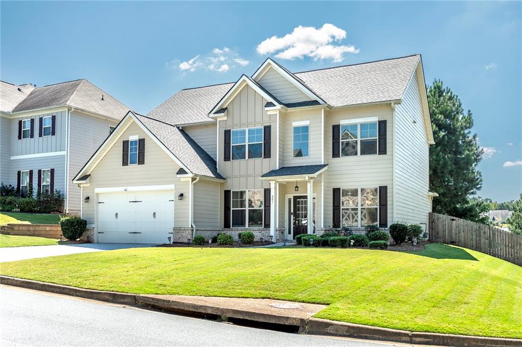 Hurry and check out this Gorgeous New Listing in the desirable Oakleigh Pointe Subdivision in Dallas, GA! This beautiful corner lot features 5 bedrooms, 4 full baths almost 4,000 sq ft. The kitchen is an HGTV gourmet style with 42 in cabinets, granite countertops, double ovens, tile backsplash, a large island, breakfast area, stainless steel appliances, and hardwood floors! Large family room with a gas fireplace, bed/bath on the main, 2 story foyer with hardwood floors, formal dining room, formal living room, iron spindles, 2 car garage, fenced in yard, covered screened in extended patio with a wood burning stone fireplace perfect for game day and entertaining. Upstairs you will find a long hallway, luxurious large owner's suite with a sitting room, trey ceilings, his & her double sinks, spa like bathroom with a tiled shower & tub, and a huge walk-in closet, additional large size bedrooms and full bathrooms. Amenities include a community courtyard that provides access to a clubhouse fully furnished with a full kitchen for reservations, swimming pool with a water slide, a playground, a gym, dog park, sidewalks, streetlights and tennis courts! The community is conveniently located to schools, food, grocery stores, and more. *Professionally manicured and treated lawn. Home Warranty included! Schedule your showing today because this home will not last long on the market!