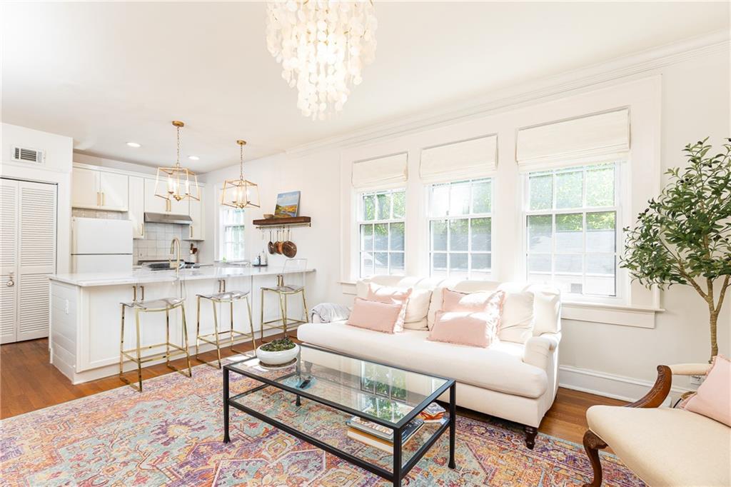 Welcome to your new home in Virginia-Highland!
This charming two-bedroom, one-bath residence perfectly balances modern updates with timeless character. Flooded with natural light, the home showcases original 1935 hardwood floors, elegant crown and baseboard molding, and thoughtful antique details throughout.
The fully renovated kitchen is a standout, featuring quartzite countertops, an oversized island, and an AGA gas range—ideal for both everyday living and entertaining. Brand-new windows seamlessly preserve the historic look while adding energy efficiency and comfort.
Beautiful window boxes line the second-floor home, bringing bursts of color and a touch of garden charm indoors. Tucked on a peaceful street just steps from the energy of Virginia-Highland, the BeltLine, and Ponce City Market, this home offers the best of both worlds—serenity at home and vibrant city living right outside your door.
Don’t miss the chance to call this Virginia-Highland classic your own!