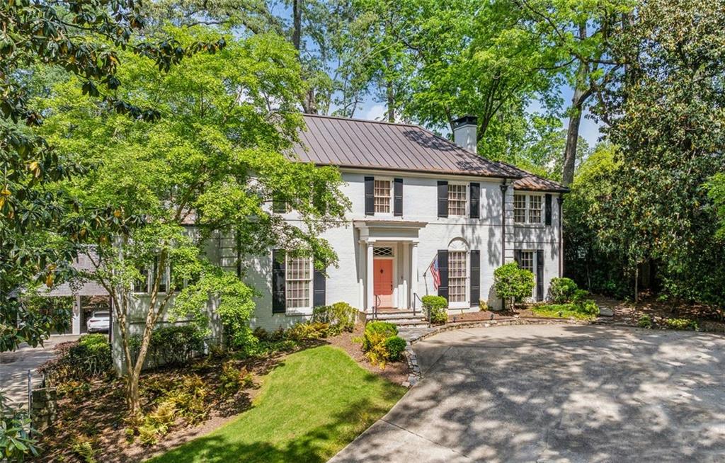 Experience timeless sophistication in the heart of Buckhead with this impeccably designed estate, privately set on 1.3 acres of manicured grounds. This remarkable residence showcases 4 spacious bedrooms, 4 full baths, and 2 half baths, each adorned with refined finishes, custom archways, and exquisite wall coverings that add depth and character throughout. A welcoming entry foyer opens to a gracious formal living room and a richly appointed home office tailored for today’s lifestyle. The gourmet kitchen serves as the home’s centerpiece, crafted for both culinary artistry and effortless entertaining, while an adjoining sitting room invites relaxed gatherings. The owner’s retreat is a true sanctuary, complete with a spa-inspired bath and an intimate reading porch. The finished terrace level enhances flexibility with space for a media lounge, playroom, or private gym. Step outdoors to a resort-style setting with landscaped grounds, a sparkling pool, and a pool house designed for ultimate entertaining. Complete with a fireside patio, kitchen, living room, sauna, and full bath, it offers the perfect backdrop for gatherings both large and small. Seamlessly blending classic elegance with modern luxury, this Buckhead masterpiece offers an unparalleled lifestyle of comfort, privacy, and distinction.