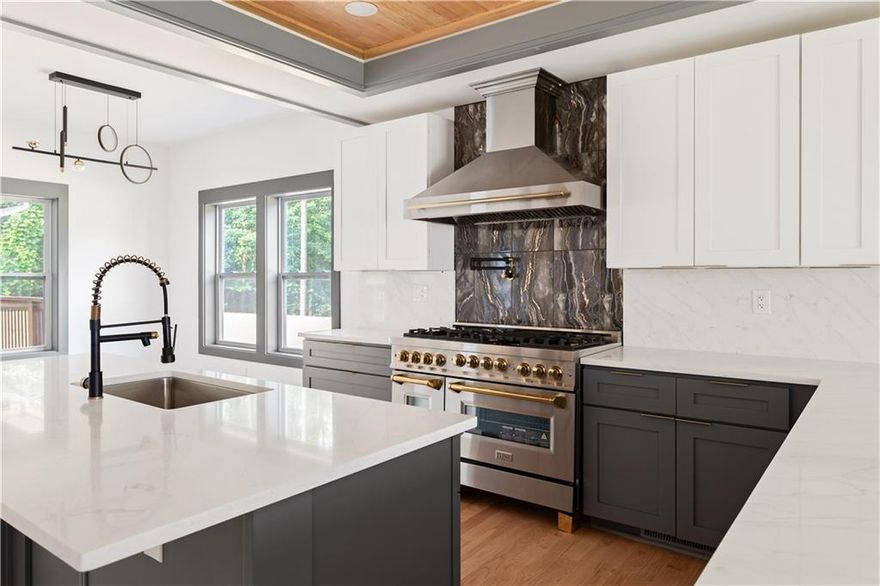 Welcome to this stunning new construction modern farmhouse, where timeless elegance meets today’s luxury in the heart of East Lake Terrace! This stunning 5-bedroom, 5.5-bathroom modern farmhouse offers 4,056 square feet of beautifully crafted living space on more than an acre, perfectly combining elegance, comfort, and functionality. Located in one of East Lake’s most established neighborhoods, you're just minutes from Barker Bryant Memorial Park, East Lake Golf Club, Oakhurst, downtown Atlanta, and a variety of shops and restaurants. Step inside to soaring ceilings and expansive natural light that highlight the open-concept floor plan. The spacious living room, complete with a cozy fireplace, flows seamlessly into a light-filled breakfast area and a stylish deck, perfect for outdoor entertaining. Off the back deck, enjoy your very own outdoor fireplace, creating a private retreat for year-round gatherings. The chef’s kitchen features custom shaker cabinetry, gorgeous quartz countertops, stainless steel appliances, and a spacious walk-in pantry with a custom wine bar, designed for both casual evenings and sophisticated hosting. The main-level owner's suite or guest suite offers flexibility, featuring a walk-in closet and full bath, perfect for multi-generational living or a home office. Upstairs, the primary owner’s retreat stuns with tray ceilings, a fireplace, and a luxurious en-suite bath with a soaking tub, oversized walk-in shower, dual vanities, and built-in closet organization. Let’s not forget, in the primary the additional his-and-her suite provides flexibility and privacy, while three additional bedrooms and all have three full baths that offers ample space for family and guests. Outside, the oversized lot offers endless potential—imagine your own pool, basketball court, or pickleball court. A 3-car garage includes an EV charging station hookup for added convenience. Don’t miss this rare opportunity to own a masterfully designed new construction home that truly has it the space, style, and an unbeatable location!