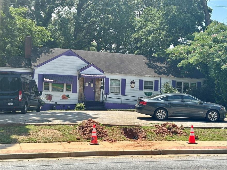 INVESTMENT OPPORTUNITY – LONG-TERM TENANT IN PLACE
This .61-acre commercial property offers immediate cash flow and future upside. Currently leased to a 20+ year operating daycare, the property includes a 1,630 SF building with strong visibility and steady neighborhood traffic. Located on a well-traveled commercial corridor in East Point, this asset is surrounded by both single-family homes and multifamily developments, enhancing its long-term viability.

The current tenant, a licensed childcare provider, continues to operate under a multi-year lease with 3 years remaining. The property is professionally managed and generates stable income, making it ideal for investors seeking passive returns with minimal overhead.

Highlights:
 • 26,800 SF lot (.61 acres)
 • 1,630 SF building
 • Established tenant in place (granddaughter of original operator)
 • Lease secured for next 3 years
 • Zoned for commercial use
 • High-demand area near schools, residential neighborhoods, and public transportation
 • Do not disturb tenant – shown by appointment only

Building only for sale – not the daycare business. This is a rare opportunity to acquire a performing asset in a growing submarket. Perfect for a 1031 exchange, investor portfolio, or long-term hold with stable returns.