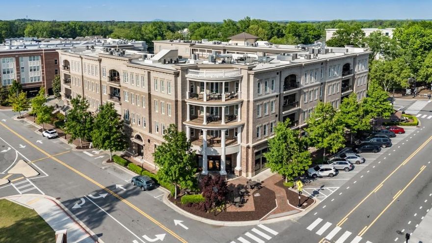 Stunning luxury condo in downtown Alpharetta with two large outdoor living spaces, lots of storage and all one level living! This top floor condo offers an unparalleled living experience boasting extensive upgrades in lighting, hardware, closets, flooring and more. This floorplan offers 3 spacious bedrooms, 3 full baths, and an additional half bath plus a separate den/study/office with pocket doors for privacy with comfortable, one-level living. Enjoy amazing views of the sunrise and sunset, fireworks at holidays and easy access to restaurants, shopping, farmers market and more. The natural light, views, open floor plan and the ample storage space with all of the custom cabinet storage space added throughout the home and three window seats with doors added for built-in storage. Situated on the coveted 4th floor, enjoy breathtaking views of downtown Alpharetta from not one, but two outdoor covered living spaces that offer phantom screens as well. The curved balcony is perfect for enjoying serene sunsets, while the primary porch complete with a cozy fireplace and outdoor gas grill becomes your personal retreat and the perfect place to gather for football games or enjoy a quiet reading space. Experience the best parking and storage solutions with three covered and secured parking spaces right next to the elevator bay along with a private, large storage unit that is climate controlled and conveniently located close to the elevators as well, for all your storage needs. Indulge in a modern lifestyle with high-end finishes including a 42" Sub-Zero refrigerator and wine cooler, custom built-in bookshelves throughout, plantation shutters, speakers and more. Enjoy the warmth of 7" hardwood floors, a stylish fireplace with marble surround, and a well-equipped built in desk area just off the laundry room. This open floor plan seamlessly blends indoor and outdoor spaces making it ideal for hosting gatherings or simply relaxing in style. Residents of Teasley Place have unlimited access to Teasley Park featuring a covered pavilion with an outdoor kitchen, dog park, and take advantage of the gym adding even more convenience to your daily lifestyle. This is a rare opportunity to own a luxurious, top floor condo in one of Alpharetta's most sought-after locations and buildings with covered parking and a climate controlled separate storage space. Schedule your private showing today and experience the elegance and comfort of residence 406 at Teasley Place!