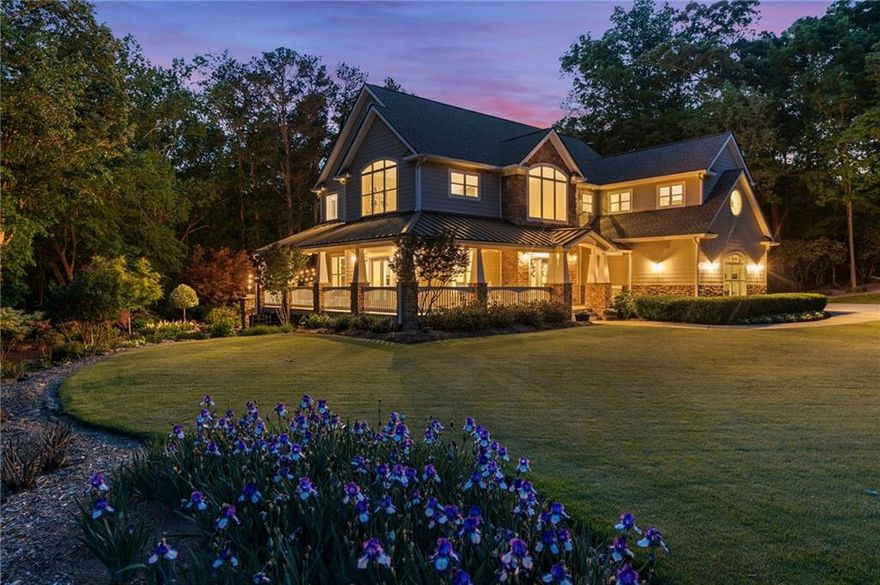 Welcome to a rare and peaceful escape in the heart of Milton—where nearly six lush, landscaped acres surround a thoughtfully designed custom home that blends comfort, beauty, and nature. At the heart of the property is an inviting infinity-edge pool, garden terraces, and serene wooded views—creating an outdoor haven made for both quiet mornings and lively gatherings.

Inside, natural light pours into nearly every room. The great room stuns with floor-to-ceiling windows, soaring ceilings, and uninterrupted views of the surrounding landscape. The two-story foyer sets the tone with grand yet welcoming energy, flowing easily into open living spaces and garden-facing rooms designed to bring the outdoors in.

Out front, a peaceful pond with a private fishing dock greets you—just one of many special spots across the property. There are blooming gardens, a flowing stream, and fruit and vegetable beds that make farm-to-table living a daily joy. Chickens? You’re covered there too, with an enclosed coop and run tucked into the landscape.

Need flexible space? The detached carriage house offers a finished garage below and an upstairs ready to become a guest apartment, office, or creative studio. With no HOA restrictions, you have freedom to make this property exactly what you want it to be.

Homes in this price range often boast more square footage—but few offer this kind of usable acreage, privacy, and lifestyle. You get the best of both worlds: a custom home, a pool, outdoor entertaining spaces, room to grow, and a second structure—all on two included parcels (22 520005370565 and 22 520005370383).