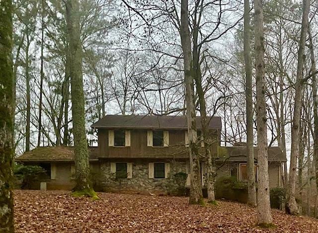 STILL SHOWING AND ACCEPTNG BACK UP OFFERS. THE POSSIBILITIES ARE ENDLESS! This 14 acres of land is a great property for builders or skilled/savvy buyers!! The property sits on a wooded and private lot right next door to a church and is located in an excellent and thriving community. The house is a fixer upper with a lot of potential or may be demolished and/or rebuilt as your Custom New Construction home. It is sold "as is" and includes 5 spacious bedrooms, 3 1/2 baths with an oversized great room area and a partially finished basement perfect for a man cave or potential mother in law suite. The possibilities for this property are limitless. The community offers great schools and is convenient to shopping, dining, and downtown Fayetteville. Looking for your dream home or a dream opportunity, bring your creativity and imagination and let's get this dream in the works! Disclosures: A NEW ROOF IS NEEDED. DUE TO WATER DAMAGE AND MOLD IN THE BASEMENT, IT IS ADVISED THAT A MASK BE WORN WHEN ENTERING. ALSO, THE DECK IS SEVERLY DAMAGED! PLEASE DO NOT WALK OUT ON THE DECK.