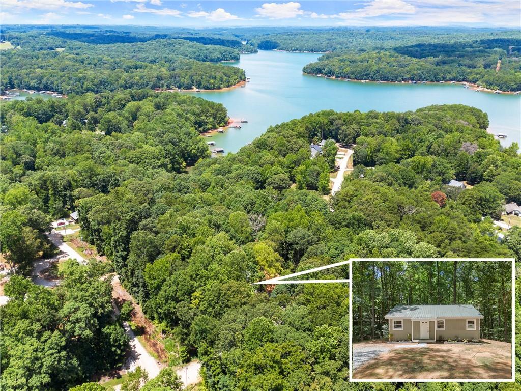 Calling all first-time homebuyers and investors… this charming, lake community cottage is ready to be called home or would be the perfect short-term rental/Airbnb! This recently remodeled home is turn key, boasting completely new upgrades throughout including new HVAC, new water heater, all new cosmetic updates, etc. No need to purchase any kitchen appliances or washer/dryer… they are already installed and ready for use! Sit on your screened-in porch and enjoy the privacy this home has to offer. Lake Hartwell is just steps away through the backyard, with lake access at the community boat ramp nearby. This home sits peacefully just 3 miles from Tugaloo State Park and is 6.5 miles from I-85. $1,000 LENDER CREDIT WITH PREFERRED LENDER- AUSTIN SAXON WITH WOODLAKE MORTGAGE BROKERS, LLC. Ask about first-time homebuyer, conventional, and other special programs!!
