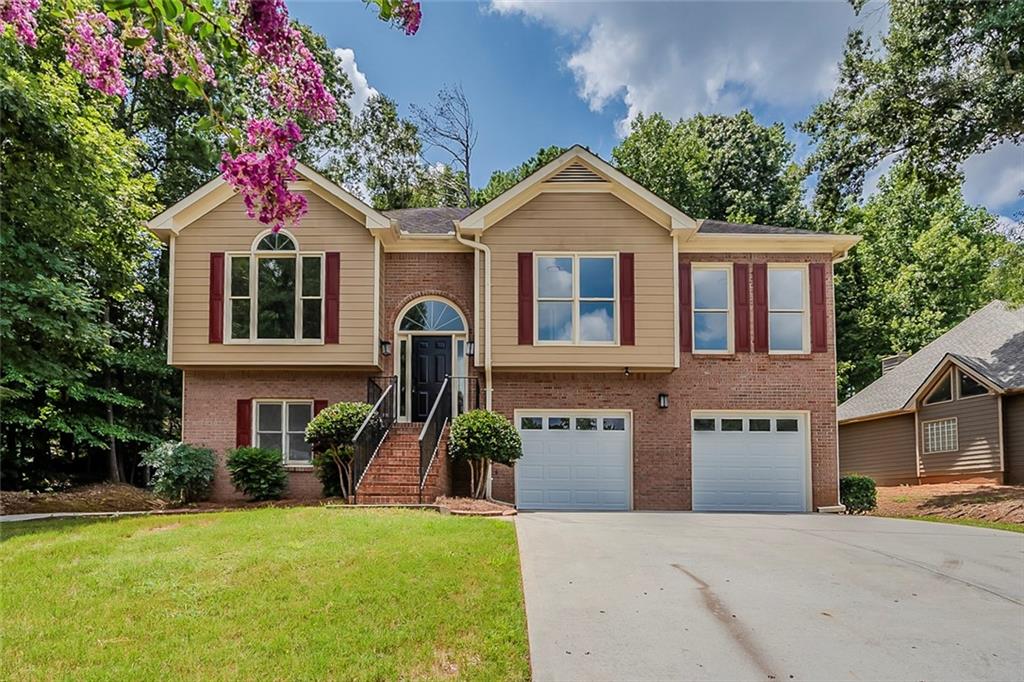 This beautifully updated 4-bedroom, 3-bath home features full interior paint, new carpet and LVP flooring, and stylish new light fixtures. The refreshed kitchen includes painted cabinets and a sleek new backsplash. Enjoy vaulted ceilings and a cozy fireplace in the living room. Bathrooms have been tastefully refreshed, and a brand-new HVAC ensures year-round comfort. Move-in ready with charm and space throughout!