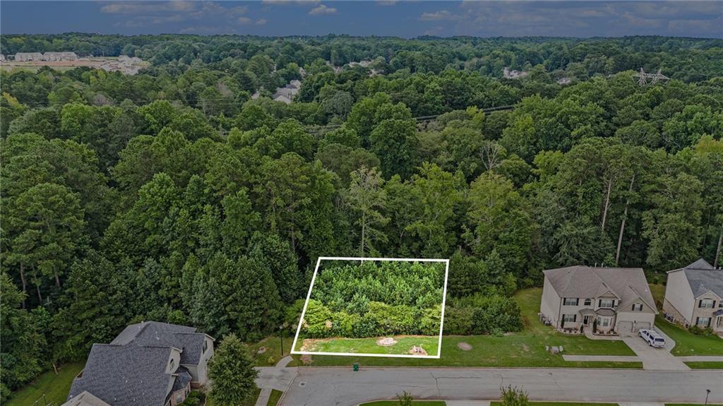 Fantastic opportunity in the well-established neighborhood of Parks at Stonecrest with its great amenities. Lot is zoned residential, and utilities are ready to go. Location, location, location-just minutes from Stonecrest Mall and I20. Seller would prefer to sell 7974 and 7980 together. 7974 and 7980 could be bundled into one sale.