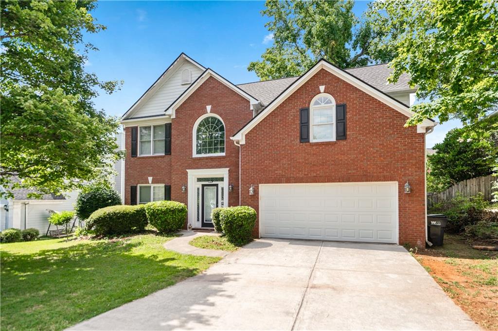 Attractive home in a highly sought after neighborhood of Lawrenceville with a low HOA and roof replaced in 2021! Welcome to this traditional brick front property featuring 4 bedrooms and 2.5 baths. Enter into the two story foyer where you will be greeted with updated flooring, bright, neutral paint colors, and loads of natural light. Just off the entry is the formal dining room with arched windows viewing into the family room which offers separate space to entertain or for a wonderful home office or study. Continue on into the family room where you will find built in shelving, a cozy fireplace, and warm toned hardwood floors. In the kitchen you will enjoy a sizable island, white cabinetry, stainless steel appliances, and a casual dining area. Also located on the main floor are the laundry room and a half bath. Head upstairs to find your oversized master bedroom with a modern trey ceiling, walk in closet, and en-suite bathroom which features double sinks, a vanity space, sleek white cabinets, a large soaking tub, and separate shower. The other three bedrooms are all spacious, feature walk in closets and share the second full bathroom with double sinks and shower/tub combo. Enjoy an easy to maintain outdoor lot with simple landscaping and fenced backyard. Enjoy the outdoors from the back patio where you can unwind or entertain! Located in a highly sought after area near local shopping and restaurants making it the ideal residence. This property currently has a tenant family who is interested in staying in the home if looking to keep this charming property as a rental opportunity.