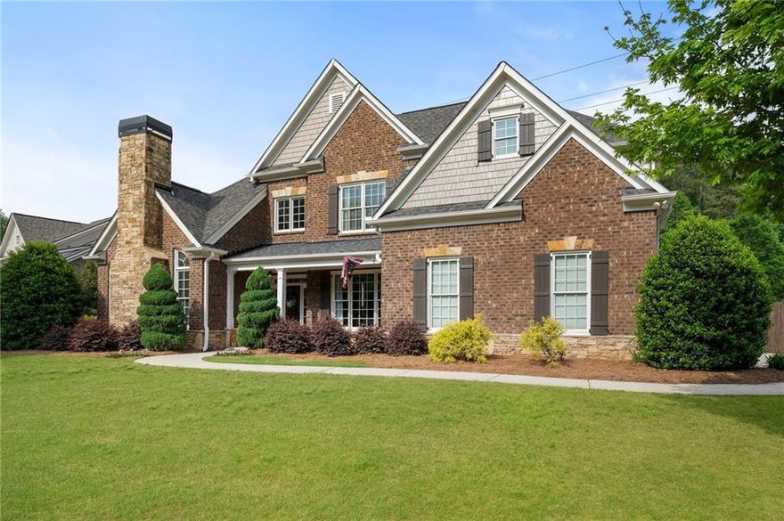 Welcome to this beautifully updated home located in one of the most sought-after neighborhoods in Marietta, Hays Farm! This move-in ready home sits on an over-sized corner lot and features 4 spacious bedrooms and 3.5 elegant bathrooms, a new roof (2024), fresh exterior paint and interior paint in two of the secondary bedrooms, a luxurious gourmet kitchen and laundry room, and new granite countertops in all the bathrooms. You can move right in! Upon entering the grand foyer, you’ll be greeted with custom trim work, beautiful hardwood floors throughout the main living area, and soaring ceilings that create an inviting and open atmosphere. To the right is the over-sized formal dining room with custom wainscotting and trey ceilings, and to the left is a sitting area/office/playroom with a gas starter fireplace that creates a cozy, comfortable space. Beyond that is the generously sized two-story family room, with a whitewash stone gas fireplace and walls of windows that create abundant natural light. You will love the owner’s suite on the main level, complete with his and her walk-in closets and a spa-like bathroom with a walk-in shower, soaking tub, and double vanities with granite countertops. Nothing was spared in the recently updated gourmet kitchen! It is a chef’s dream with elegant, soft-close custom green cabinetry with added trim work, brushed gold hardware, and undercabinet lighting. It also features white subway tile backslash, double ovens, a 4-burner gas stovetop, a quartz granite composite sink w/ a garbage disposal button, quartz countertops, and a large kitchen island with bar seating and overhead lighting. There is also an eat-in kitchen and a large walk-in pantry. Past that is the elegant laundry room, complete with extra cabinets that reach the ceiling, slate herring bone floor, marble countertops and sink. Upstairs you will find 3 generously sized secondary bedrooms with large walk-in closets, and 2 bathrooms, a Jack-n-Jill and an en-suite, each with new leathered granite countertops, and a step-up oversized loft area perfect for hanging out and relaxing with the family. The massive backyard is an entertainer’s dream, with flagstone pavers, a cedar pergola, custom TV cabinet and sound system, firepit area, plenty of green space for outdoor activities, and a freshly stained fence. The backyard is super private and backs up to Kennesaw Mountain National Battlefield Park with trail access directly from the neighborhood for hiking enthusiasts and features an irrigation system to keep the beautifully landscaped yard looking in top shape! This active community includes a clubhouse, swimming pool, playground, tennis courts, and fun festivities throughout the year! It is conveniently located near great schools, downtown Marietta, shopping/restaurants, and just 30 minutes to downtown Atlanta. Homes in this neighborhood do not come to the market often, so schedule your tour today!