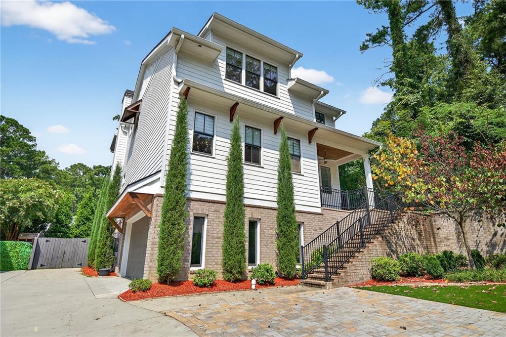 Welcome to your oasis in the heart of desired Ashford Park — minutes from all that Chamblee, Brookhaven, and Atlanta have to offer. Perched on a quiet, private, tree-lined lot, this like-brand new home features every bell and whistle imaginable and will wow you from the moment you walk in the door. Featuring SIX spacious BEDROOMS, FIVE luxurious FULL BATHS, 4200 square feet of living space, and the most incredible BACKYARD PARADISE you’ll see in the area, no detail was overlooked in the customization and upgrading of this home. Bright, open floorplan with incredible CHEF’S KITCHEN… the OUTDOOR SPACE truly must be seen to be believed… the wellness & entertainer’s paradise features fabulous BACK PORCH, totally private, FLAT, FENCED, usable, TURF BACKYARD with custom stone paver patio, 5-person jacuzzi, firepit and infrared/red light SAUNA, OUTDOOR SHOWER, newly added under-deck storage and more… FINISHED BASEMENT with NEW LVP, home gym, NEWLY RENOVATED full bath, bonus living space, storage and more… this home epitomizes luxury living from the moment you walk in the door. Two-car garage with epoxy floors offers plenty of space plus additional, NEWLY paved parking pad… NEW light fixtures and hardware all throughout… NEWLY upgraded, painted island, bar area, deck and more… Located in Chamblee/Brookhaven’s jewelbox, Ashford Park, enjoy easy access and walkability to so much that the area has to offer… minutes to Downtown Chamblee, Brookhaven Village, I-85, Buckhead, Midtown, so many favorite restaurants, shops, parks, schools and more.