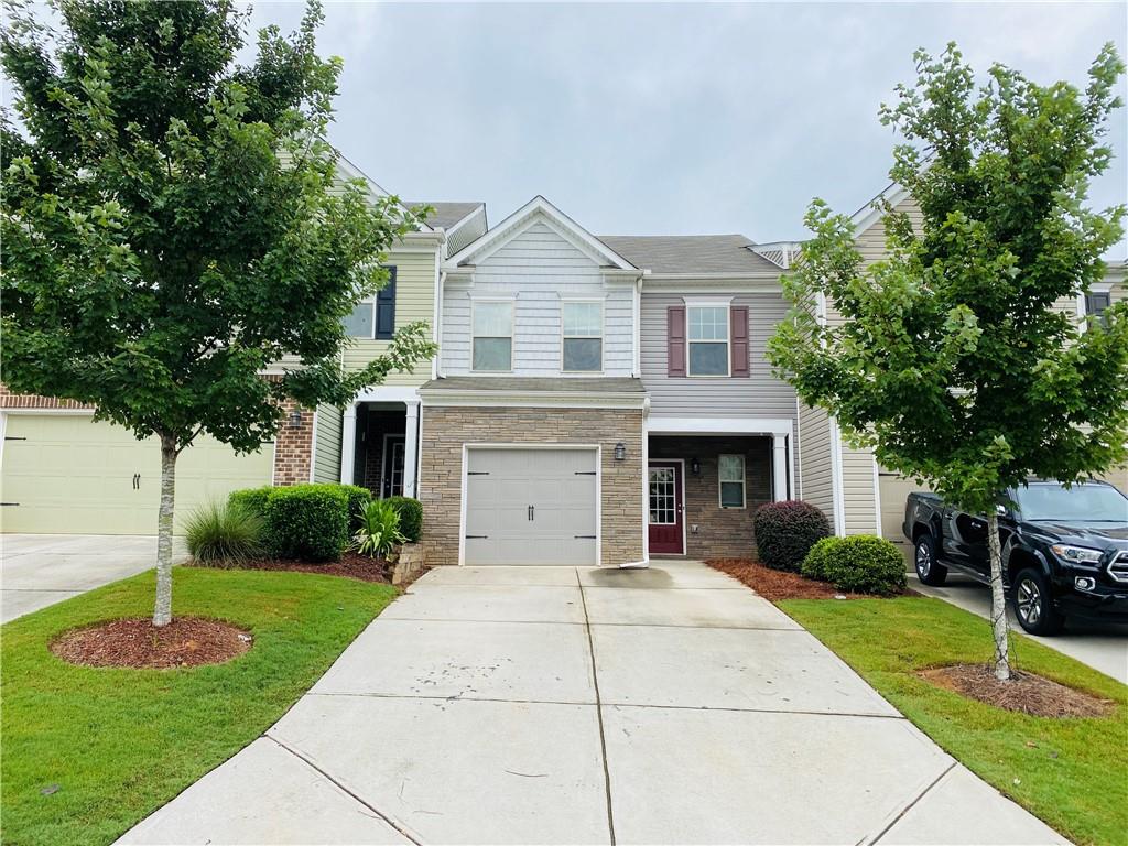 Townhouse close to Hwy 400 with an upgraded Kitchen and Stainless steel appliances. Interior features include Hardwood Floors, a fenced yard with Granite & gorgeous Cabinetry! 3 Bedrooms/2.5 baths: Master Bath with soaking tub, dual vanities, and plenty of closet space; 2 additional bedrooms plus a loft/sitting area! Swim/tennis! UNG/Cumming, Aquatic Center, Outlet Mall- all close by!. HOA paid by owner includes Swim , Tennis , Lawn care and Trash