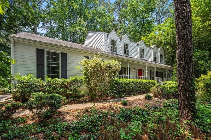 Walton HS OPPORTUNITY – RENOVATE & REIMAGINE!
Don’t miss this chance to transform a traditional home in one of East Cobb’s most sought-after school zones: Mount Bethel Elementary, Dickerson Middle, and Walton High. Nestled on a gentle hill, the home offers PRIVACY and curb appeal.
Inside, you'll find a spacious, welcoming foyer—thanks to the centrally located staircase at the rear of the home. The foyer is flanked by a large living room and an oversized dining room, perfect for entertaining. The kitchen opens to a bright and airy SUNROOM, ideal for a cozy keeping room or casual dining space.
A generous family room with a fireplace has French doors to the living room, and direct access to the back deck makes for a perfect gathering space. Upstairs, the primary suite has two large WALK-IN CLOSETS, and private bath. There are three additional bedrooms and a hall full bath, offering plenty of room for family or guests.
The outdoor space includes a DECK with just 4 steps to a PATIO, and a LEVEL BACKYARD with incredible potential to be transformed into a "play" area. There is a gorgeous stacked stone short retaining wall and 4 steps to the backyard. Enjoy the closeness to the LAKE COLONY amenities including a POOL, TENNIS COURTS, and PLAYGROUND. IDEAL LOCATION only minutes from shopping, dining, and major highways. Note: no powerlines behind the property.
Tremendous POTENTIAL awaits – bring your vision!