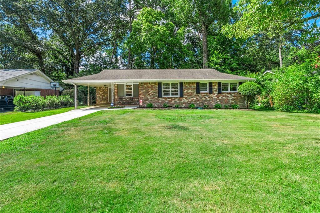 Nestled in the desirable Lindmoor Woods subdivision, this inviting single-story ranch boasts a brand-new kitchen featuring a stylish island, crisp white cabinetry, and new flooring that enhances the fresh, open space. The three comfortable bedrooms provide ample space for family and guests, complemented by a full bathroom and a convenient half bath. The level backyard provides ample room for outdoor fun and relaxation, perfect for family gatherings or gardening enthusiasts. Greet neighbors from your front porch and the brand new driveway makes parking a breeze. This home is just steps from the Lindmoor Woods Swim and Tennis club. Easy access to Decatur, local shopping, and the highly anticipated Lulah Hills development!