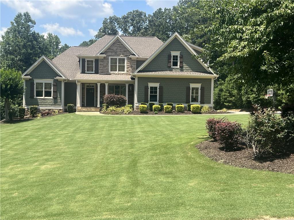 Distinguished gem! Country estate on three private acres with full terrace-level in-law suit, gated community in Creekview school district! If you need to house additional family, this is it! Terrace level has full in-law suite w living area, fireplace, bedroom, full bath, full kitchen, washer/dryer hookup and private patio area. House thoughtfully built for numerous people with two water heaters and 3 HVAC units. Everyone has hot water! Every level controls their temperature! And look at this! Terrace level has additional ample storage/extra expansion space. Main level has hard woods throughout with elegant stone fireplace. Wide kitchen with abundant storage space, eating area and eat-in island. Primary bedroom has generous amount of space and awaiting your decorating touches. You just have to see this primary bath! His/her sinks, soaking tub, separate shower and large walk in closet. Upstairs also has enormous multipurpose bonus room over garage. Hidden storage areas throughout home. Large screened porch and patio for perfect entertaining day to night. Deck spills into beautiful backyard surrounded by privacy trees. Pool in your future? You’re set there too! Septic tank strategically placed on side of back yard with plumbing added to accommodate future pool. Nature trail on property right beside stream! Freshly painted interior. 5 minutes from shopping, restaurants and hospital. This quality rare so get here quick!