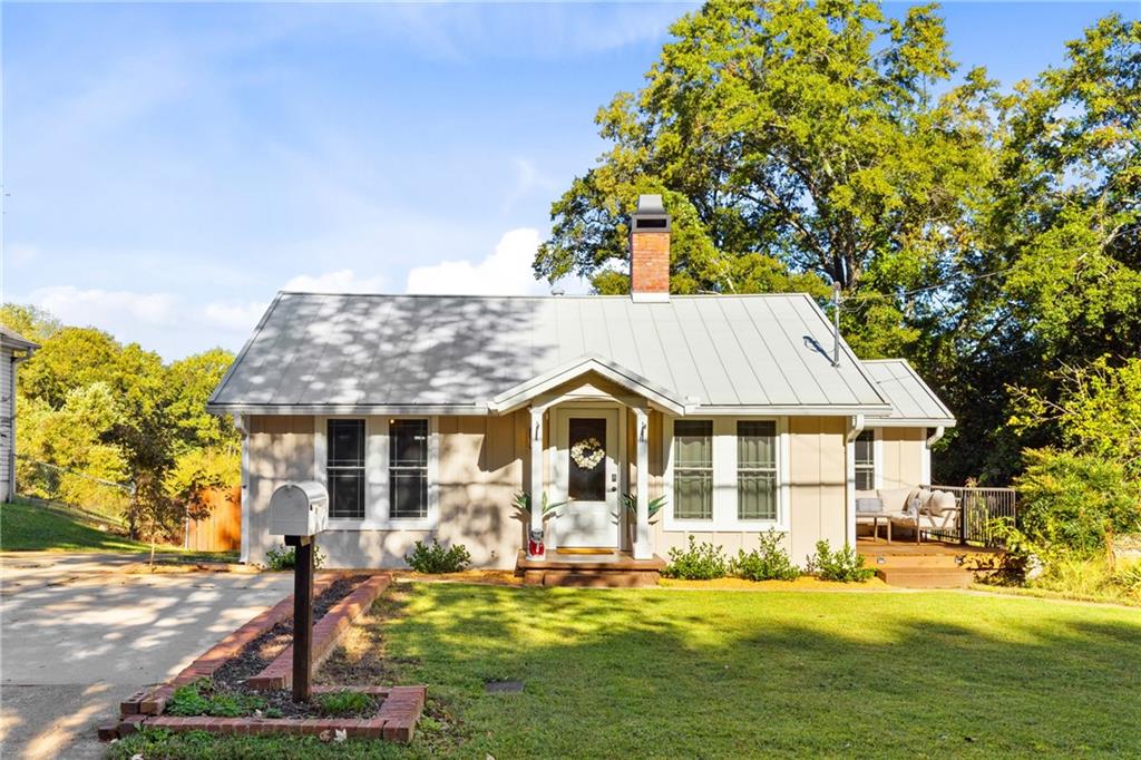Prime Location in the Heart of Downtown Buford!
Welcome to 399 Jackson Street, a charming and beautifully updated home ideally situated in one of North Georgia’s most sought-after areas. Nestled just steps away from Historic Downtown Buford, this property offers unbeatable access to top-rated restaurants, boutique shopping, live music venues, coffee shops, and more—all within walking distance!
This beautifully refreshed home boasts recent renovations throughout, offering the perfect blend of style, comfort, and functionality. Outside this home has a NEW STANDING SEAM METAL ROOF and a NEW HVAC - including new duct work and new registers in the home. There’s more - NEW SIDING ON THE FRONT AND BACK OF THE HOME, NEW GUTTERS, and NEW EXTERIOR PAINT! Enjoy your morning coffee or evening drinks on your NEW SIDE AND REAR DECKING or play in the huge, flat, fenced in backyard!
Inside this showcase home has recently been added a NEW SLIDING DOOR, A NEW CLOSET SHELVING SYSTEM AND ENGINEERED HARDWOOD FLOORING. The interior is recently painted and has a ton of natural light with new windows throughout, vaulted ceilings, a sizeable dining area, oversized primary bedroom with a huge walk in closet and 2 additional bedrooms and 2 baths. The kitchen provides plenty of cooking and storage space. An added bonus is a partial basement with exterior entrance for storage.
Don’t miss out on this rare opportunity to live in Buford. Consistently ranked among the top-performing public schools in Georgia, this district is known for its academic excellence, elite athletic programs, and supportive community. Homes within this district are in high demand—and this one is a true standout. CHECK OUT THE VIDEO LINK FOR A TOUR OF THE HOME