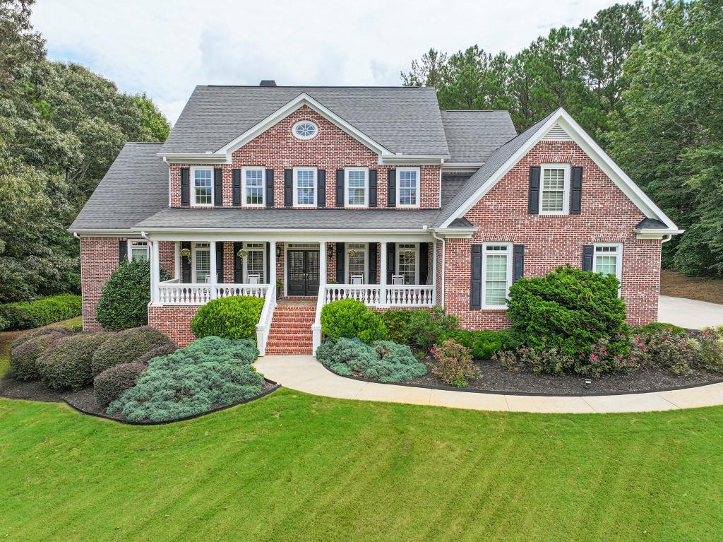 Exquisite custom estate on a private 1-acre cul-de-sac lot in an exclusive enclave of 12 homes. Four-sided brick with timeless curb appeal, lush landscaping, and an elegant front porch. Inside, a grand foyer opens to a soaring two-story great room with custom built-ins and a shiplap fireplace, flanked by a vaulted sunroom filled with natural light. The chef's kitchen dazzles with custom-painted cabinetry, a new backsplash, quartz counters, premium Dacor appliances, and a brand-new dishwasher. The main-level primary suite features a spa-inspired bath and a freshly painted retreat. Designer updates include new HVAC, Nest thermostats, new gutters, faucets, paint, lighting, Ring doorbells, and digital locks. The upper level boasts spacious bedrooms, a Jack-and-Jill bathroom with new faucets, and a bonus room. Terrace level is an entertainer's dream with new flooring, custom theater with 4K projector, surround sound, game/rec rooms, gym, and guest suite. Private backyard with pool potential. Top-rated Mill Creek schools!