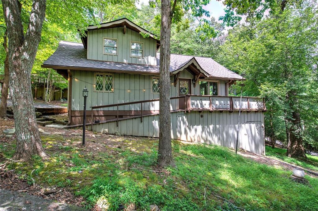 Charming Mountain Cottage in Sought-After Bent Tree Community!
Welcome to this delightful mountain retreat nestled in the desirable Bent Tree Community of North Georgia. Brimming with character, this beautifully updated home features brand-new appliances and fresh white-washed interior paint, creating a bright and airy ambiance throughout. Step inside to discover the perfect blend of rustic charm and modern comfort. A stunning natural stone fireplace anchors the living space, complemented by warm earth tones and soft textures that invite relaxation.
Whether you're searching for a weekend getaway or a cozy full-time residence, this mountain gem is move-in ready. Enjoy peaceful mornings on the deck, breathe in the crisp mountain air, and soak in the serene beauty of the natural surroundings.