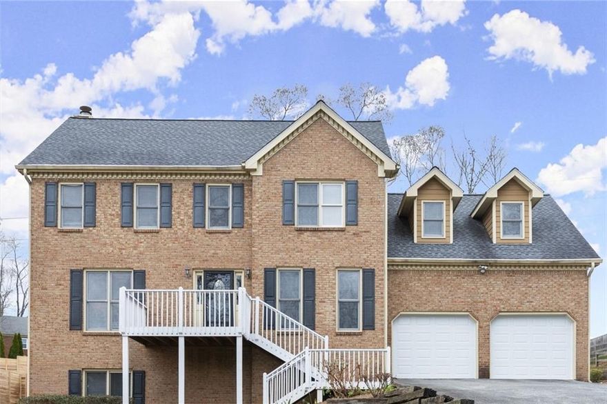 DON'T MISS this lovely home located in the highly desirable East Cobb Blackwell Chase subdivision. Boasting 5 bedrooms and 3.5 baths, this home offers a perfect blend of space, style, and functionality. The main level features hardwood floors throughout, a large dining room perfect for entertaining, and a versatile living room that could be used as a home office. Relax in the oversized family room with a cozy fireplace, or step outside onto the expansive deck overlooking a flat, private backyard. The upper level features a large primary bedroom and ensuite bathroom with double vanities, jetted tub, separate shower and his and hers walk in closets. Three large additional bedrooms with lots of closet spaces and a bathroom. The fully finished, self-contained basement is a standout feature. Complete with a full kitchen, living room, bedroom, bathroom, an additional room ideal as an office, exercise room, or another bedroom, plus large bonus room that can be used as a walk in closet, craft room or office space. It is perfect for an in-law suite, a college student, or even as a potential Rental Space For Extra Income. Updates, include a new garage doors and newer stainless steel appliances. With its convenient location and thoughtful layout, this home offers everything anyone needs and more.  No  HOA.  Swim membership can be purchased at Blackwell Bend subdivision.
