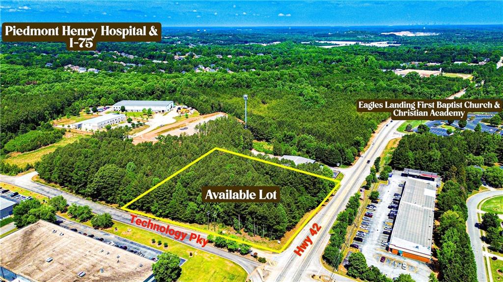 Wooded lot featuring frontage on Technology Pkwy and Hwy 42