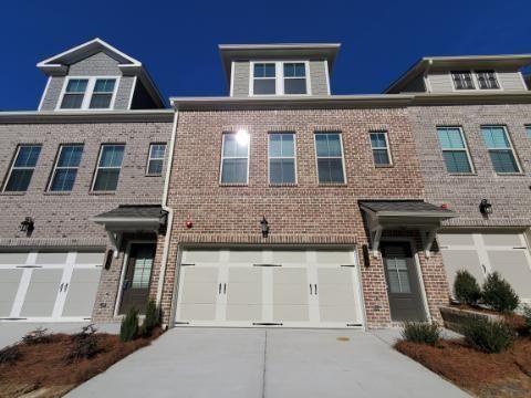 For Lease or Lease Purchase. Amazing Opportunity to Lease a 2022 Luxurious, Like New, Three Story Townhome at Brookside Lake Manor. Desirable Open Floorplan with Two Car Garage. Private Back Deck to Enjoy the Outdoors with Wooded View. The Main Living Level is Bright and Open with Gorgeous Kitchen with Large Island, Tall Grey Modern Cabinets, Top of the Line Quartz Countertops and Backsplash which overlooks the Dining Area and Great Room with Fireplace. New Sleek Stainless Steel Appliances including Side-by-Side Refrigerator. Fantastic for Entertaining and Everyday Living. Wrought Iron Spindles and Wood Stair Treads. Luxury Plank Floors. The Upper Level of this Amazing Home has the Master Suite with a Stunning Upgraded Bathroom featuring a Large Shower, Large Tile, Double Sink Vanities and Generous Sized Walk-in-Closet. Upper Level also Hosts a Secondary Bedroom with Private Bathroom. Additional Bedroom or Office on the Terrace Level with Full Bathroom Offers Plenty of Space for Everyone. Spacious Nice Community Pool and walking trail. Easy Access to I-285, Airport, Downtown. Close to Shopping and Restaurants. Washer/Dryer and Lawn Maintenance is Included. Nice Freshly painted and new flooring. Great Community. Please Call for a viewing today!