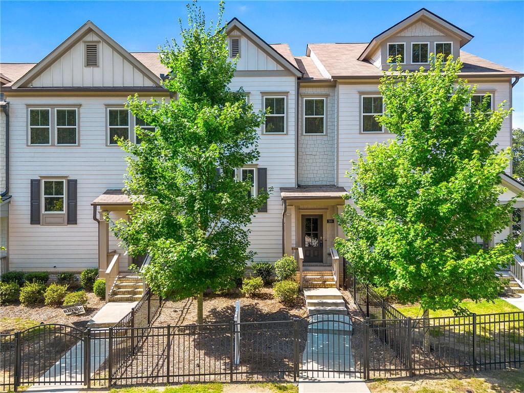 PRICE IMPROVEMENT: $2,400/mo. Space, style, and low-maintenance living come together in this 3-level 4BR/3.5BA townhome—perfect for a Lock-&-Leave lifestyle in Woodstock. On the main level, an open kitchen-to-dining-to-living flow keeps everyone connected, and the back deck is your go-to for morning coffee or quiet evenings. Upstairs, the light-filled primary suite has its own private bath, plus two additional bedrooms and another full bath. Downstairs, a finished lower level adds a versatile 4th bedroom + full bath—think guest suite, home office, media room, or second living space. Set in a friendly neighborhood with sidewalks and streetlights, you’re moments from the Greenprints Trail System for miles of walking, running, or biking. Downtown Woodstock is just a quick hop for great restaurants, shops, festivals, and small-town charm—an easy blend of peaceful and plugged-in. ***Resident Benefit Package – $15/month Includes quarterly air filter delivery, online tenant portal, after-hours emergency maintenance, and one-time late fee forgiveness (if rent is paid in full by the 10th). Applicant Requirements: Credit score of 650+ and Monthly NET income at least 3× the rent.***