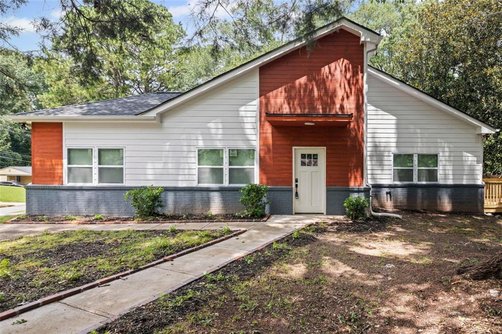 Step inside this completely renovated home where modern design meets timeless comfort. Taken down to the studs and rebuilt from the ground up, every inch of this property has been carefully crafted with high-quality finishes and thoughtful details. Boasting the largest square footage in the neighborhood, this home offers an expansive layout rarely found in the area. The kitchen is a true centerpiece, featuring walls of windows that drench the space in natural light, a generous island with seating for casual dining, gleaming quartz countertops, and brand-new stainless steel appliances that will delight any home chef. From the kitchen, the open-concept floor plan flows seamlessly into the dining area and the spacious family room, anchored by a sleek electric fireplace that serves as both a cozy gathering spot and an eye-catching design feature.
The private primary suite offers a luxurious retreat with its spa-inspired bathroom, complete with a double vanity, an oversized standing shower with frameless glass, and premium tile work. Two additional bedrooms provide ample space for family, guests, or a home office, all served by beautifully updated bathrooms with modern fixtures and finishes.
Step outside to the brand-new deck overlooking a fully fenced backyard—perfect for entertaining, gardening, or simply enjoying your morning coffee in peace. Every element of this home, from the new mechanical systems to the designer lighting, has been selected for style, comfort, and long-lasting value.
Located just minutes from the freeway and less than ten minutes from Lakewood Amphitheatre, the Atlanta Airport, and a variety of shopping and dining destinations, this property offers an unbeatable combination of elegance, functionality, and convenience.