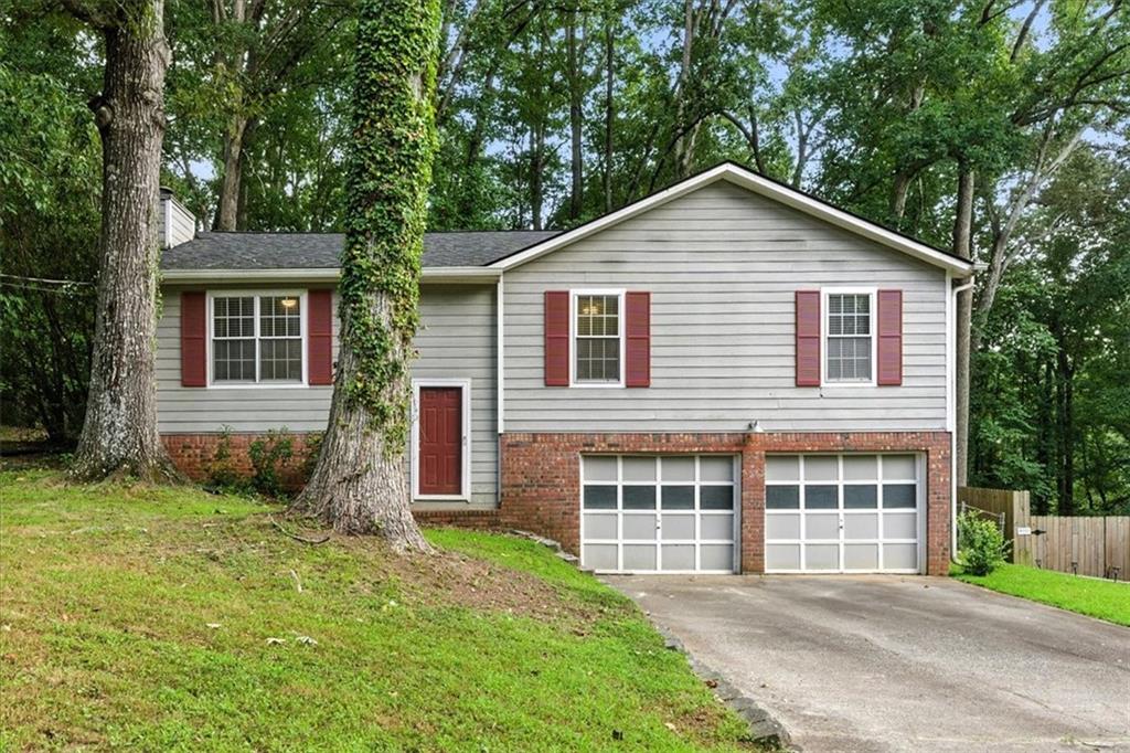 Welcome to 3849 Bentley Drive! This charming, ready-to-move-in 3-bedroom, 2-bath home is full of potential and features a brand new roof for your peace of mind. The split-foyer layout offers 1,288 sq ft of living space upstairs, along with an unfinished basement ready for your personal touch. The main level is cozy yet spacious, with a warm and inviting design perfect for everyday living. Outside, enjoy a fenced backyard with a deck that's perfect for entertaining or grilling. Whether you're a first-time buyer, an investor, or looking to create your dream home, this property presents a fantastic opportunity in a quiet Douglasville neighborhood. Don’t miss your chance—bring your ideas and make Bentley Drive your new home!