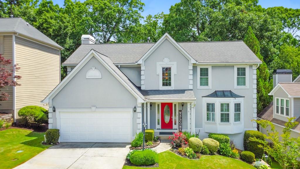 Welcome home to this beautiful 4 bedroom, 3.5 bathroom residence in the sought-after Riverside at Mulberry Farms community! From the moment you step into the 2-story foyer, you'll be impressed by the space and versatility this home offers. A flexible front room—perfect as a sitting area, office, or playroom—flows into the separate dining room, ideal for entertaining. The kitchen features white cabinetry, stone countertops, a pantry, and a sunny breakfast area overlooking the fireside family room, complete with built-in bookshelves. A convenient half bath rounds out the main level. Upstairs, the spacious primary suite is a true retreat with vaulted ceilings, a large walk-in closet, and a spa-like ensuite bath offering double vanities, a whirlpool tub, and a separate glass-enclosed shower. Two additional bedrooms share a full bath, and the laundry room is also located on this level for convenience. The finished basement expands your living space with a large bonus room, a bedroom, and a full bathroom—perfect for guests, a home gym, or media room. Enjoy outdoor living year-round from the glass-enclosed porch, which leads to a lower-level patio and fenced backyard. Additional highlights include an attached 2-car garage and location in the top-rated Walton High School district. Just minutes from fantastic shopping, dining, and everything East Cobb has to offer! Don’t miss this incredible opportunity! **Seller to offer $20k towards buyer's closing costs, buy down rate, improvements, down payment, etc. with all reasonable offers**