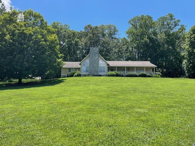 APPRAISAL COMPLETED! This Custom Built Ranch home on 3.23 acres in the sought after Coosa Walk community, is a dream home for a family or couple seeking one level access. The home includes the lot attached that is on a separate deed, allowing to retain or sale. The master and secondary bedrooms are extra large. Loft can be turned into one or 2 additional bedrooms, as can the basement. A separate driveway allows for easy access to basement for rv, boat or additional cars and parking.
They do not build homes like this anymore, its solid, with so much growth potential. One owner, who had the visionary and carpentry skills to see what could be improved upon for a large family if the space was needed. You must see to appreciate the quality of this home.
Large screened sun room, looks out onto all hardwood trees.