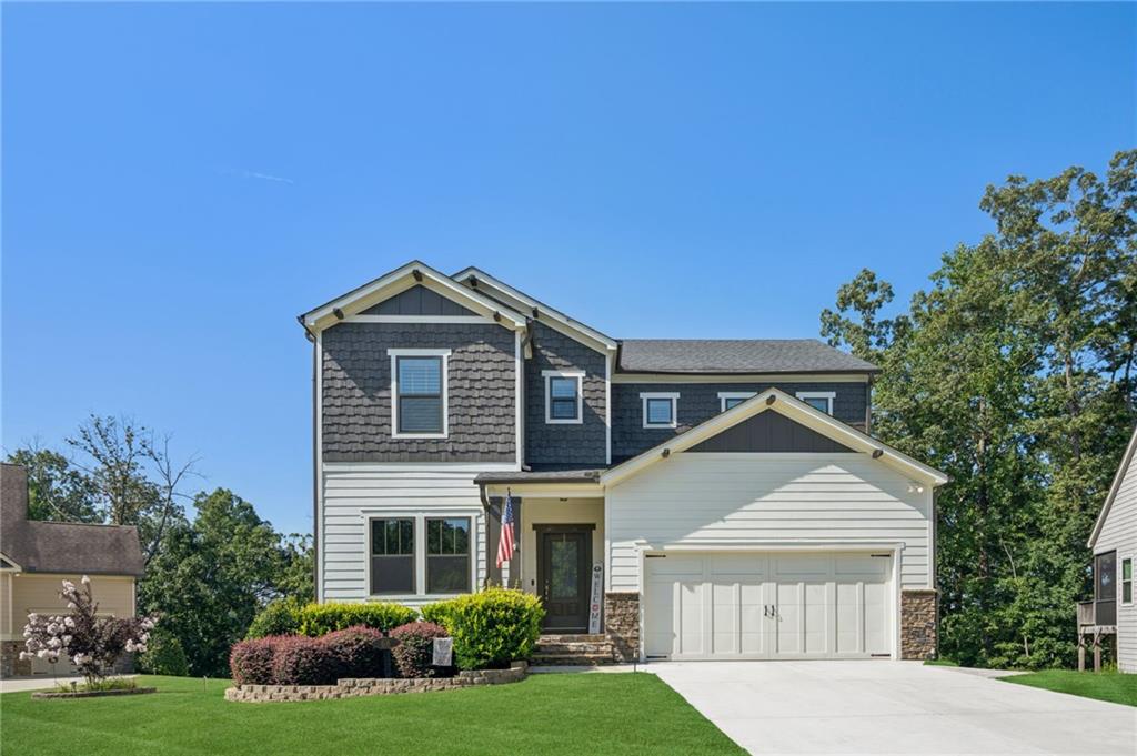 Experience Luxury Lake Living at Dawson Pointe on Lake Lanier* 6BR/5.5 BA Luxury Home in Gated Lake community on nearly half-acre lot in park-like cul-de-sac. 2 Owner's Suites, One on Main level & 2nd upstairs. Open Floorplan with Chef's Kitchen with many upgrades: Quartz counters, SS Appliances, Double Ovens, Copper sink, Bosch dishwasher & Hardwood floors... Family Room features a stack stone fireplace and walk-out to a beautiful screened porch overlooking the backyard. A study on Main would make really cool office. Master Suite & retreat on main features double shower heads, double vanities, & a large walk-in closet. 3 more spacious bedrooms upstairs. Finished Terrace level features 1BR/1BA, Family Room, great for entertaining & workshop. **Option to purchase with dock slip #40 in the 48 slip community dock. Dawson Pointe offers premier amenities: Clubhouse, Swimming Pool, Tennis courts & more.... Just minutes from GA400, N Ga Premium Outlet Mall, Restaurants, Fitness Centers, and more... Your lake life is calling, without all the maintenance! Schedule your private tour today!