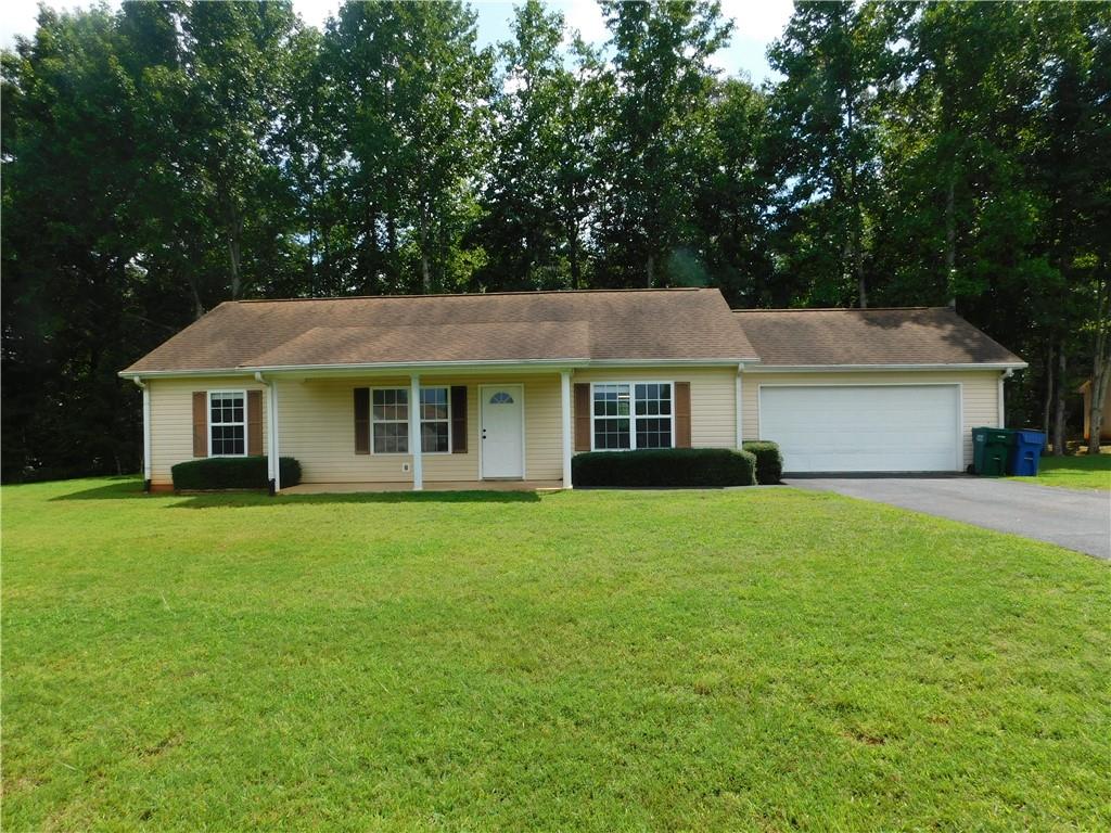 Immaculate single-family home located in Dahlonega, Georgia, near the Dahlonega Square. This 3-bedroom, 2-bathroom split plan home features large bedrooms and a spacious floor plan, all situated on a one-acre lot with a serene view. The kitchen boasts ample cabinet space and countertops, complemented by a separate dining room and family room. Enjoy the convenience of a large double-car garage with an automatic opener and direct entry to the home. A dedicated laundry room with washer/dryer hookups adds to the home's functionality. Utility fees of $65.00 per month cover water, septic, lawn maintenance, and landscaping. Please note, no pets allowed. Contact for more information on this exceptional rental opportunity.