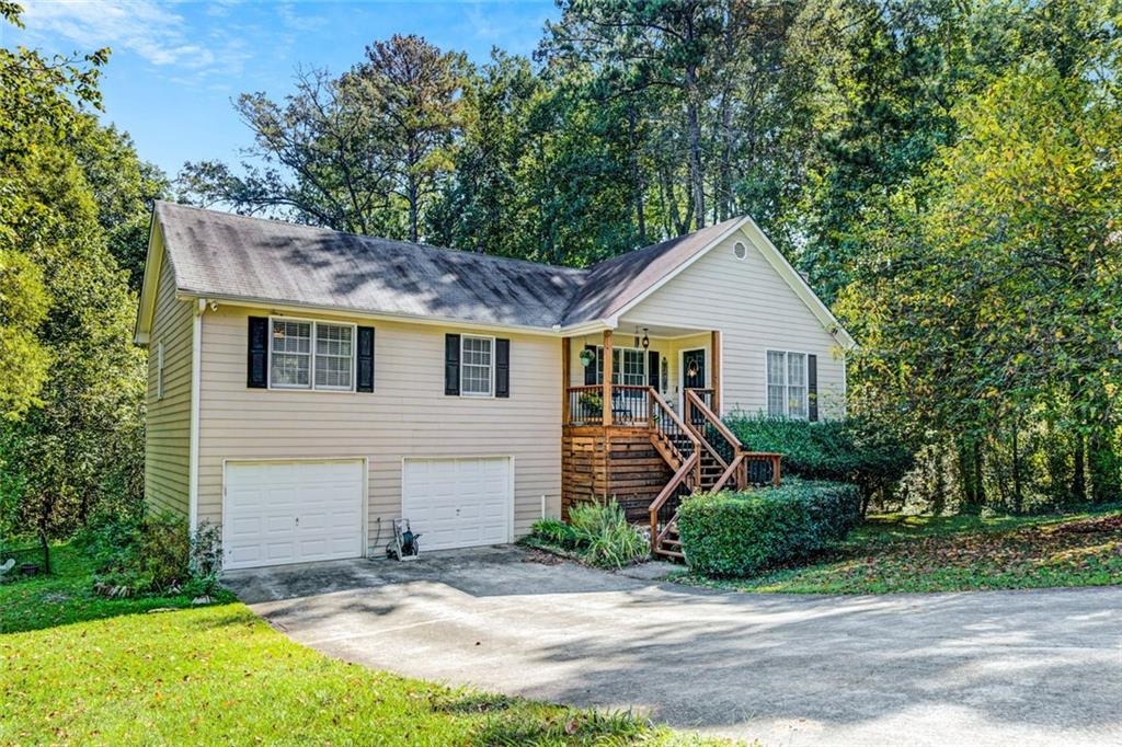 This lovely ranch style home is located in the sought after Olde Mill Ford subdivision off of Jamerson Road. Located a half mile from Woodstock city limits minutes from downtown Woodstock. Commuting is easy with I-575 and Route 92 just a few miles away. With low Marietta taxes and no HO, this home truly has it all. This property has been lovingly cared for but, still needs some TLC. Located on a spacious half acre plus lot which backs up to a natural area and creek. Please check out flood plan map (reference only) in documents. This property has all sorts of potential and is priced to sell. Don't miss out on this opportunity. Showings will start on Saturday, September 13th.