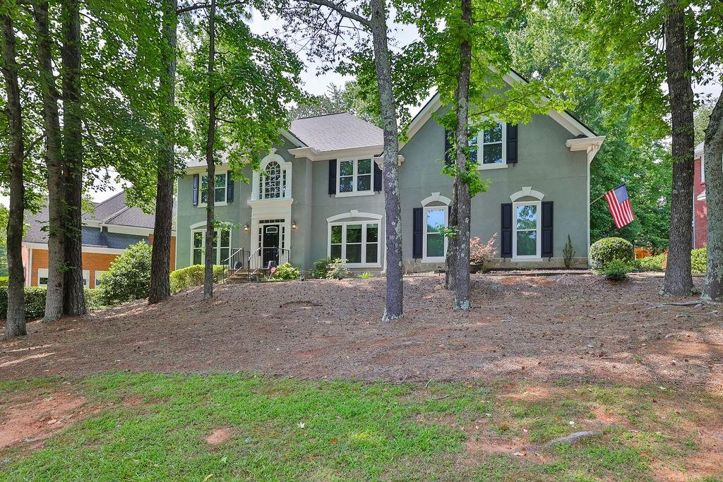 Gorgeous Immaculate Home with Custom Renovated Open Kitchen, Hardwood Flooring throughout the Main Level! Outstanding Family Room overlooks the Private Backyard! Bedroom with Full Bath on Main Level! Gracious Flowing Formals! Private Master Retreat with Updated Spa Bath! All Secondary Bedrooms are Size Plentiful! Outdoor Cooking Station! Sought After Community and School Cluster!