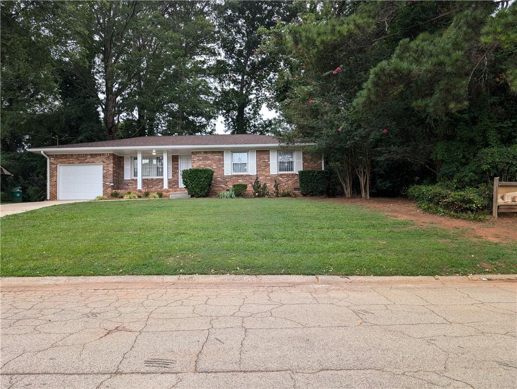 This exquisite 3 bedroom, 1.5 bath home is nestled in an established quiet neighborhood, offering a balance of comfort and convenience. The updated kitchen is a highlight, featuring modern stainless-steel appliances that blend style with functionality, making cooking a joy. The home also features new flooring throughout the home, new roof and gutters, new garage door, alarm system, fenced in backyard, and a corner lot.
The 4-sided brick home is located in close proximity to Stone Mountain Village and Park. Easy access to Marta and all major interstates is a stone's throw away. This gem is perfect for a first-time homebuyer or an investor looking to add to their rental portfolio! Don't let this once in lifetime asset slip through your fingers. By the way did I mention that the SELLER IS HIGHLY MOTIVATED!!!