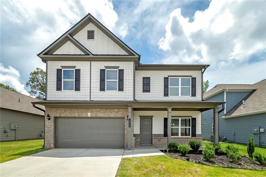 Just like new! This beautifully maintained 4-bedroom, 3-bath home in the heart of Adairsville features an open-concept layout perfect for entertaining. The spacious living room flows seamlessly into a modern kitchen complete with granite countertops, a large island, and ample cabinet space. Enjoy a bedroom on the main level with private access to a full bath, ideal for guests or a home office. Upstairs, you'll find a generous owner’s suite with a walk-in closet and spa-like ensuite bath, along with two additional bedrooms and a full bathroom. Other highlights include luxury vinyl plank flooring, neutral paint tones, and an abundance of natural light throughout. Step outside to a private backyard and covered patio, perfect for relaxing or hosting gatherings. Located just minutes from I-75, local schools, and shopping. Move-in ready, don’t miss this one!