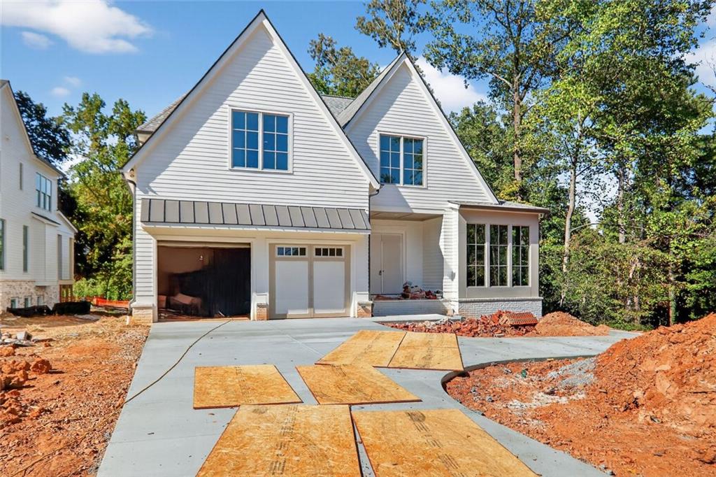Last 2 homes available in Millgrove, Bedrock Homes newest project in Chamblee set for Mid November completion.
Thoughtfully designed floor plans and custom-curated finish specifications. All 3 homes are under construction
with planned closing dates in October. Front elevations boast a blend of brick, stone and smooth siding with light
color schemes and soft warm tones. Open and functional interior spaces brightened with large windows and slider
doors. The homes feature 10 foot ceilings on the main floor and 9 foot and vaulted ceilings on the upper. Full guest
suites, mudrooms and powder rooms on the main levels in addition to walk-in pantries, entertainment bar spaces,
and a full JennAir appliance packages including a 42" built-in refrigerator. Covered back porches offer a 2nd fireplace
and overlook wonderfully landscaped backyards with privacy fencing. The owner's suites feature vaulted ceilings,
separate tubs, walk-in showers and 2 generously-sized closets. Wide plank white oak flooring throughout with tile in
the full baths and laundry. Full, daylight basements provide almost 2000 additional square feet for future finish.
Easy access to incredible dining options, shopping, grocery, highways, Chamblee Rail Trail and Sexton Woods
tennis courts, playground and other amenities!