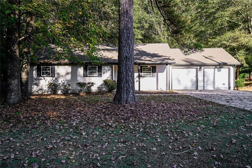 Find peace and fresh beginnings at this beautifully renovated ranch tucked in the quiet Country Woods community. Warm light fills every room, offering comfort after a long day, while the fireplace invites cozy evenings with family and friends. Outside, the spacious yard is perfect for cookouts, games, and quiet mornings under the Georgia sky. Experience the perfect blend of comfort and country charm—schedule your showing today and see why this feels like home.