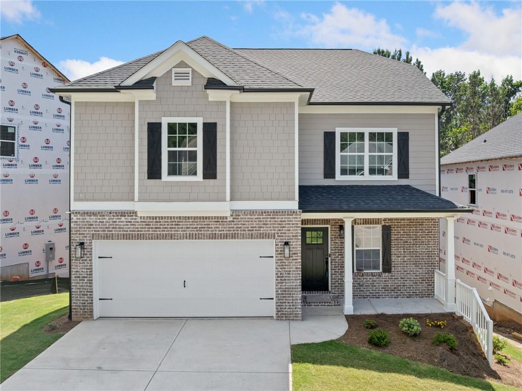 Gorgeous 4 bedroom 2.5 bath home, with an extensive unfinished basement. This new build home is in the center of the lush Crestmont neighborhood near the new Holly Springs downtown development. Beautiful spacious kitchen with granite countertops, kitchen island and tile backsplash. Hardwoods throughout the main and features charming built in cabinets in family room surrounding the fireplace to cozy around and enjoy with family. Family room leads out to the back deck where the warmer months can be enjoyed. Granite countertops and ceramic tile in all bathrooms and showers. Master suite features tray ceilings with ample sunlight and a vast his and hers walk in closet. Basement is stubbed for bath and ready to finish. Crestmont amenities consist of swim, tennis, pickle ball and clubhouse included with HOA. Delightful family home to make lasting memories.