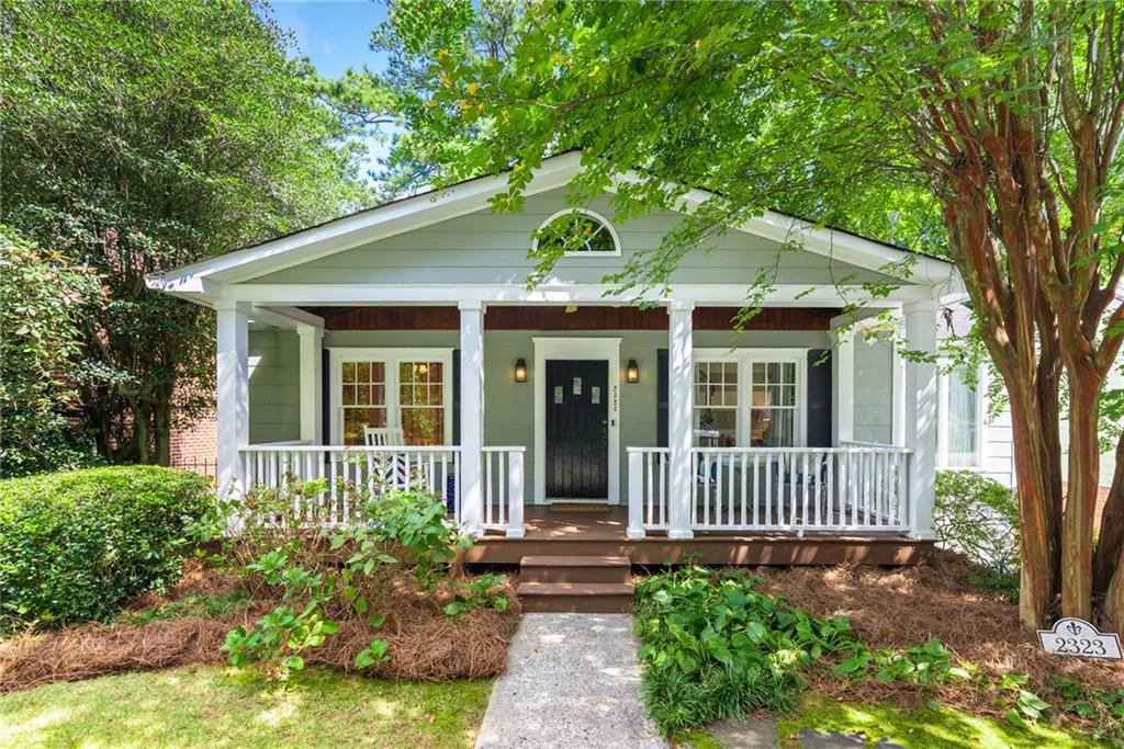 Nestled in the heart of Peachtree Hills, this delightful three-bedroom, three-bath bungalow offers the perfect blend of historic charm and modern updates. A white picket fence and classic rocking chair front porch set the tone for this storybook home, while a dedicated off-street parking space adds convenience.
Inside, rich hardwood floors flow throughout the main level. The vaulted ceiling in the dining room compliments the vaulted ceiling in the kitchen complete with granite countertops, stainless steel appliances open to the breakfast area. A welcoming guest bedroom and full bath complete the 1st floor.
Downstairs, the terrace level owner’s suite impresses with an enormous walk-in closet and a luxurious travertine bath featuring a walk-in shower and Jacuzzi tub. The lower level also includes a laundry area for ease of access, along with a private guest suite offering its own exterior entrance.
The backyard is designed for both relaxation and entertaining, with a serene patio and fenced-in yard. All of this is just a short stroll to neighborhood favorites—restaurants, Peachtree Hills Park, and the recreation center with tennis courts, an indoor basketball court, fitness center, and after-school programs.
This home is a rare find in one of Atlanta’s most beloved intown neighborhoods!