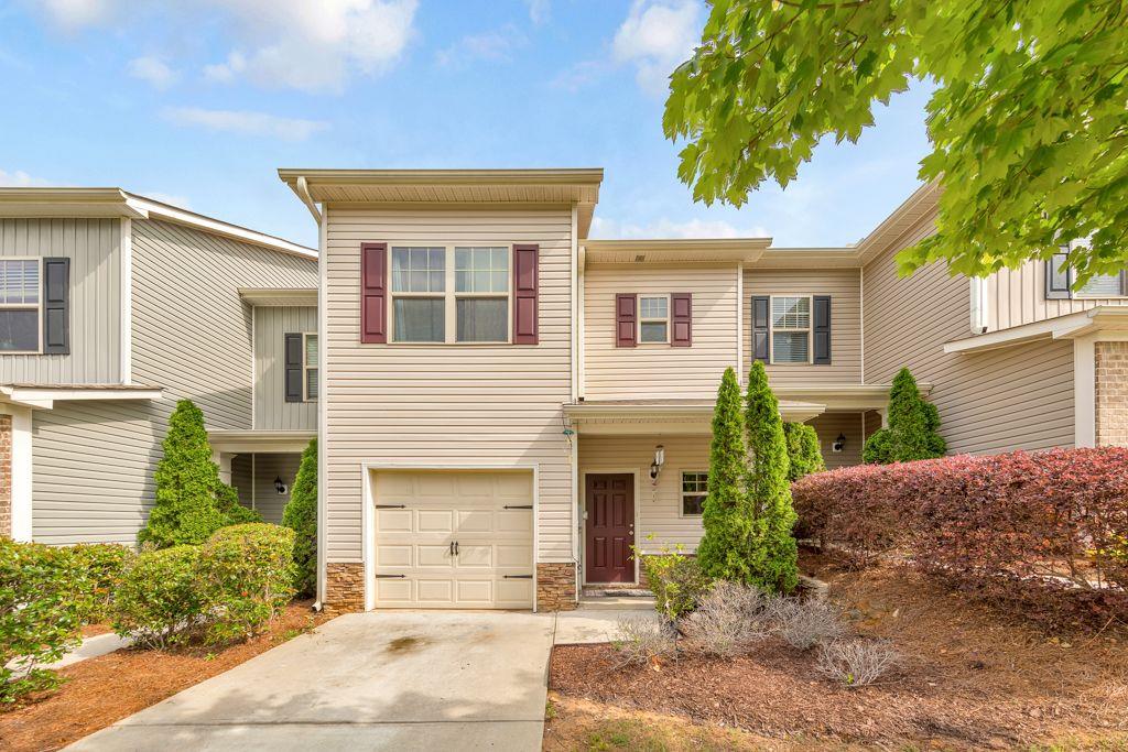 Welcome to this beautiful 3 bed / 2.5 bath townhome nestled within the desirable Ridge Mill community, known for its prime location. All new interior paint! Upon entering, you are greeted by a sun-filled foyer that leads you to an open and inviting great room - perfect for entertaining guests or spending quality time with family. The elegant kitchen boasts ample counter space, making meal preparation a breeze. The upper level owner's suite is a spacious retreat, featuring elegant trey ceilings. The ensuite bathroom offers a double vanity and a tub/shower combination. Two secondary bedrooms share a spacious bathroom. The laundry closet is located on the upper level making chores a breeze. Step outside to the back patio that is perfect for enjoying summer evenings or simply unwinding after a long day. The HOA takes care of lawn maintenance and trash. Community amenities include a refreshing pool for hot summer days, a playground for little ones to enjoy, and a greenspace for walks and picnics. Just minutes away from highways 575/75, Town Center Mall, Lake Allatoona, KSU, and downtown Woodstock, Acworth, & Kennesaw. Don't miss this incredible opportunity to make this home yours!