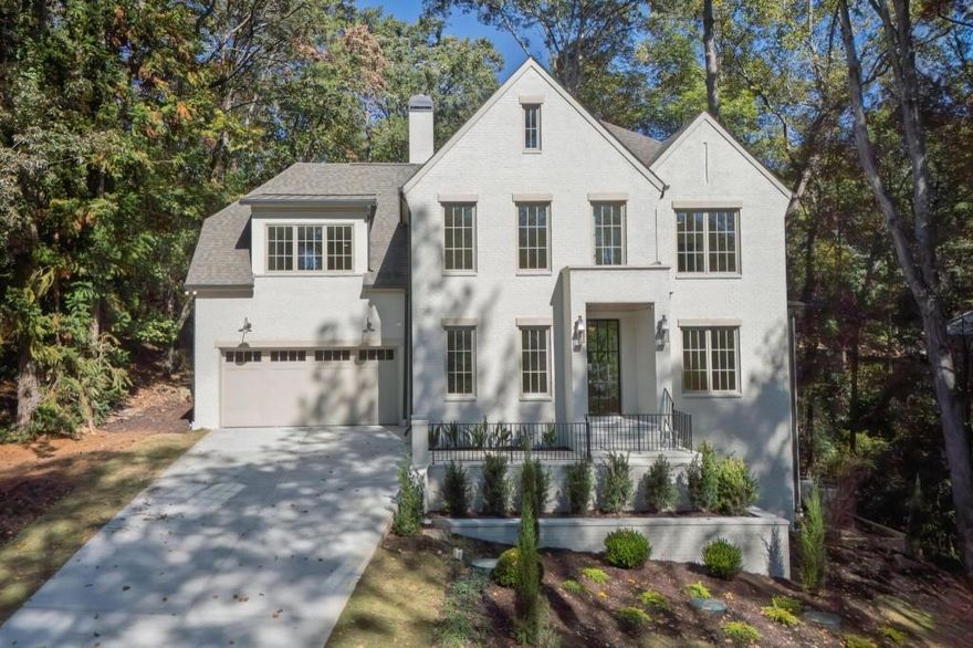 Stunning New Construction in Buckhead Built by SouthCrest Homes perfectly set on Cloudland Drive and surrounded by mature hardwoods, this new home offers a rare combination of privacy, convenience, and timeless design. With close proximity to outstanding private and public schools, as well as shops and restaurants, opportunities for new construction in this location are nearly impossible to find.  A gracious foyer opens to beautifully curated interiors by Bellweather Interiors. The first-floor primary suite features a spacious bedroom, a luxurious bathroom, and incredible his-and-hers closets. Upstairs, four large bedrooms and a versatile media/study room create a layout that is both unique and highly functional-designed to live and flow effortlessly.  At the heart of the home, the chef's kitchen showcases premium appliances, an oversized island, and expansive windows overlooking a private wooded backdrop. The open family room extends seamlessly to a covered porch with fireplace, offering year-round indoor-outdoor living.  This property blends elegance, livability, and a rare wooded setting-an extraordinary find in Buckhead.