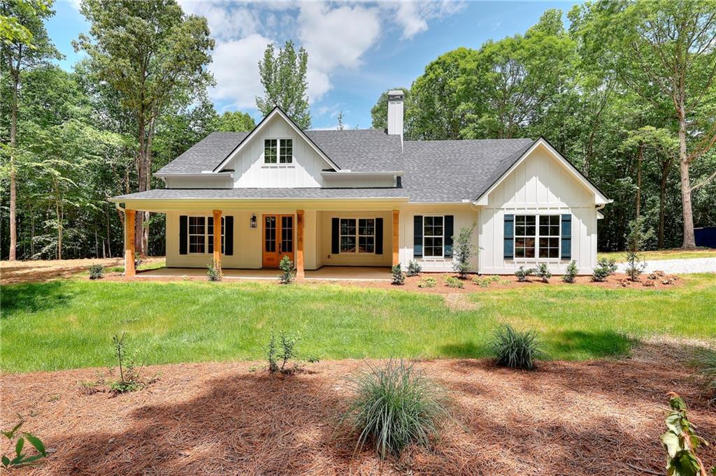 Beautiful, custom new construction home situated on 8.25 +/- acres, just minutes from Athens and within walking distance of South Jackson Elementary. This 4-bedroom, 3.5-bath home features an open-concept floor plan with vaulted ceilings and exposed wood beams, creating a bright and spacious living area. The master suite is a true retreat, featuring a spa-inspired bathroom with a walk-in tiled shower and elegant finishes. Upstairs, you'll find a generously sized bonus room that can flex as a home office or media room. The heart of the home flows seamlessly to a large covered back porch-perfect for relaxing or entertaining while enjoying your private wooded backdrop. Don't miss the opportunity to own this rare gem combining new construction craftsmanship with acreage, privacy, and proximity to top-rated schools and future amenities! **** SELLER PAID CLOSING COST of $15,000 (can go towards upgrades/buydowns/etc) ***If you use our preferred lender, an additional 1% of the purchase price will be applied.