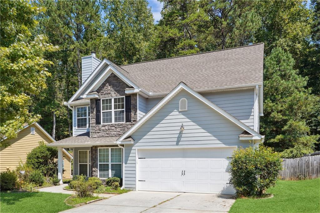 Seller willing to do interest rate buy down. 2% first year and 1% the second year. Could save 400 per month. See flyer in Documents for details. This Vibrant Freshly Painted Home only minutes from Ga 400, outlets & other amenities offers an array of open space from the family room, kitchen & dining area w/ a large eat-in kitchen island & breakfast nook. Hardwoods throughout main w/ beautiful Stacked stone fireplace & half bath on main. Relax in the sitting room nestled within the large master suite that offers a spacious garden tub/sep. shower & double vanity. Bedrooms offer spacious closet space & Large laundry room. From the level fenced private back yard w/extended patio & large deck this home will stand apart from the rest.