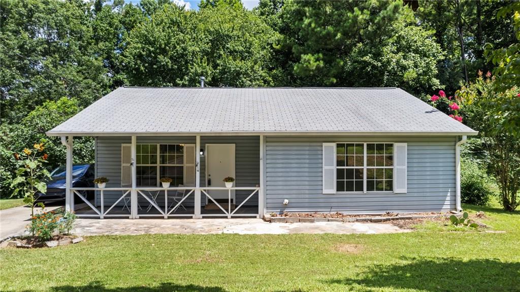 This move-in ready home combines comfort, convenience, and lifestyle in one of the area's most sought-after locations. Perfectly located just steps from Logan Farm Park and within walking distance to historic downtown Acworth. This charming 3-bedroom, 1-bath home enjoys fresh interior paint, brand new LVP flooring throughout, updated vanities, and new appliances in the kitchen. The backyard offers privacy and direct access to the park, making it ideal for outdoor enthusiasts. Plus, you're just a short golf cart ride away from the sandy shores of Acworth Beach.