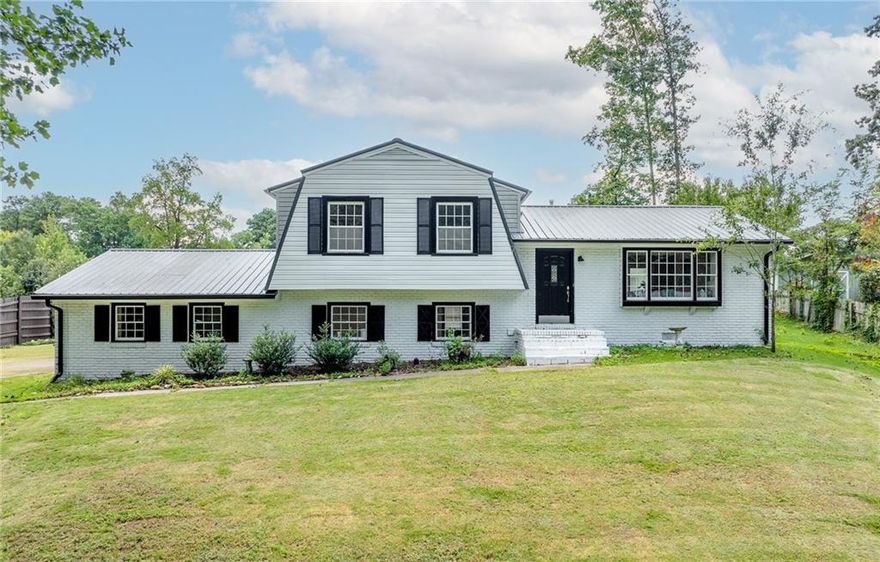 Back on Market!! No fault to seller! Stunningly renovated 4-sided brick split-level in the sought-after Piedmont Hills community. This spacious 5 bedroom offers an open-concept layout with expansive windows that fill the home with natural light. The modern kitchen boasts quartz countertops, subway tile backsplash, floating shelves, stainless vent hood, and all NEW appliances now included (photos were taken before installation, come see them for yourself!). A bright sunroom overlooks your private backyard retreat, complete with koi pond and a swimming pool with renovations currently underway. The lower level features a bedroom, full bath, large den, laundry, and exterior access, perfect for a guest suite, home office, or multi-generational living. Recent updates include fresh interior and exterior paint, new flooring throughout, stylish bathrooms, and a durable metal roof. Conveniently located near I-575, shopping, dining, and excellent schools. This home has been completely transformed inside and out, from the upgraded kitchen and renovated baths to the refreshed outdoor living space. The seller is motivated and ready to make a deal. Schedule your private showing today before this one is gone again!