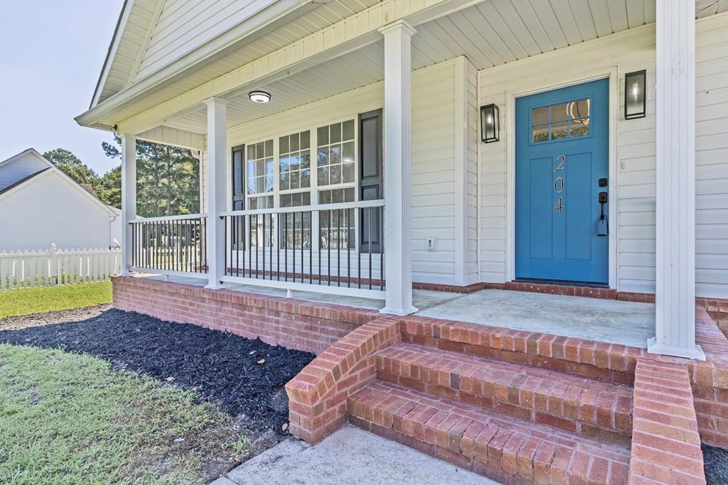 Welcome to 204 Erin Lane! Beautifully renovated in a quiet neighborhood within a great school district, this home is move-in ready. The kitchen features granite countertops, stainless steel appliances, and updated cabinetry. The primary suite offers a soaking tub and custom tile shower, with an additional tiled bath for guests. Enjoy fresh flooring, modern lighting, and spacious living areas. The large backyard is perfect for gatherings, and the screened back patio comes with heating and air conditioning for year-round comfort.