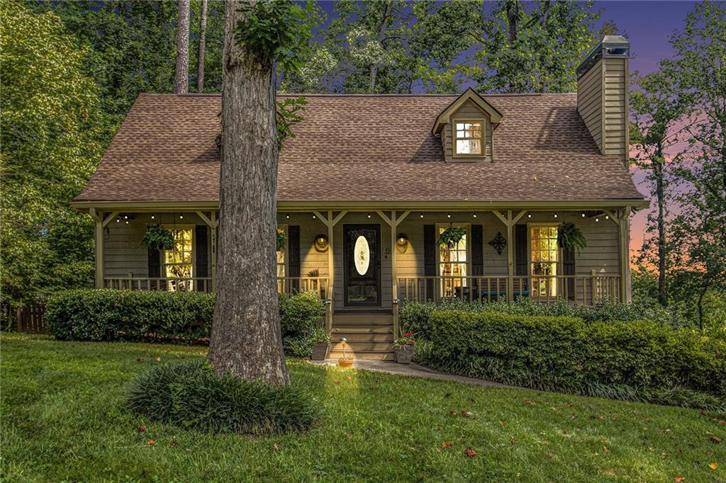 Welcome to your new haven—a charming cedar-sided home with over 2,100 square feet of comfortable living, shaded by majestic trees and complete with a fully enclosed fenced backyard perfect for pets or a garden. Recent updates add peace of mind, including a new roof, HVAC system, and hot water heater, all from 2023. French doors installed in 2022 lead you to a rebuilt back deck ideal for relaxing evenings under the stars. Inside, the hardwood floors guide you through three spacious bedrooms and two bathrooms, including a beautifully renovated upstairs bath that feels like a spa day—minus the fluffy robe. The primary bedroom offers a cozy retreat, and the basement provides endless storage or hobby space (dream wine cellar, anyone?). Nature lovers will enjoy the tranquil rock waterfall and fire pit, while practical perks like gutter guards and new windows (front and side in 2024) boost efficiency and style. There's even a pre-listing, roof, and termite inspection already done, so your weekends are free for exploring. Located in the inviting community of Farmington, you are 10 minutes from downtown Woodstock, parks like JJ Biello and attractions such as Northside Hospital-Cherokee Amphitheater, you’re also minutes from River Ridge schools, grocery stores, and shopping at familiar favorites like Publix, Kroger, Walmart, Home Depot and Lowe's. All this comes wrapped in a lovely neighborhood setting where tree-lined walks, friendly faces, and Saturday BBQs might just become your new normal. Come see why this easygoing home is ready to become your favorite place on Earth.
