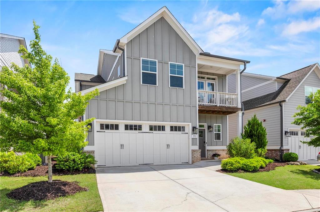 Welcome to Promenade at the Square! Just steps from vibrant Marietta Square, 553 Onyx Landing is one of the finest homes in this sought-after community. Built in 2019, this residence offers breathtaking Kennesaw Mountain views and convenient access to City Club Marietta Golf Course. The bright, open-concept main level features a welcoming foyer, formal dining room, modern kitchen, spacious living area, powder room, and a luxurious primary suite with a beautifully designed bath and generous closet space. Enjoy morning coffee or evening sunsets on the charming front balcony. Upstairs, find three well-appointed bedrooms, one with an en-suite bath, plus another double-vanity bathroom and a versatile loft perfect for a home office, playroom, or relaxation space. Ample storage includes a spacious attic and abundant closets throughout. The fenced-in backyard with a private patio creates a perfect retreat for relaxation or entertaining. As part of the original section of the neighborhood, residents enjoy access to the community pool, with yard maintenance included in the affordably-priced HOA. Don’t miss this exceptional home in a premier location! The Listing Agent resides in the neighborhood, has been here since the start of construction, and is the most knowledgeable about the community—reach out with any questions!
